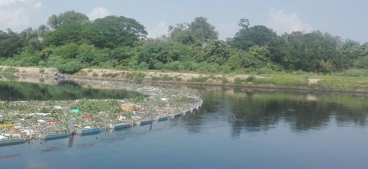 Floating trash barrier for river and lake cleanup